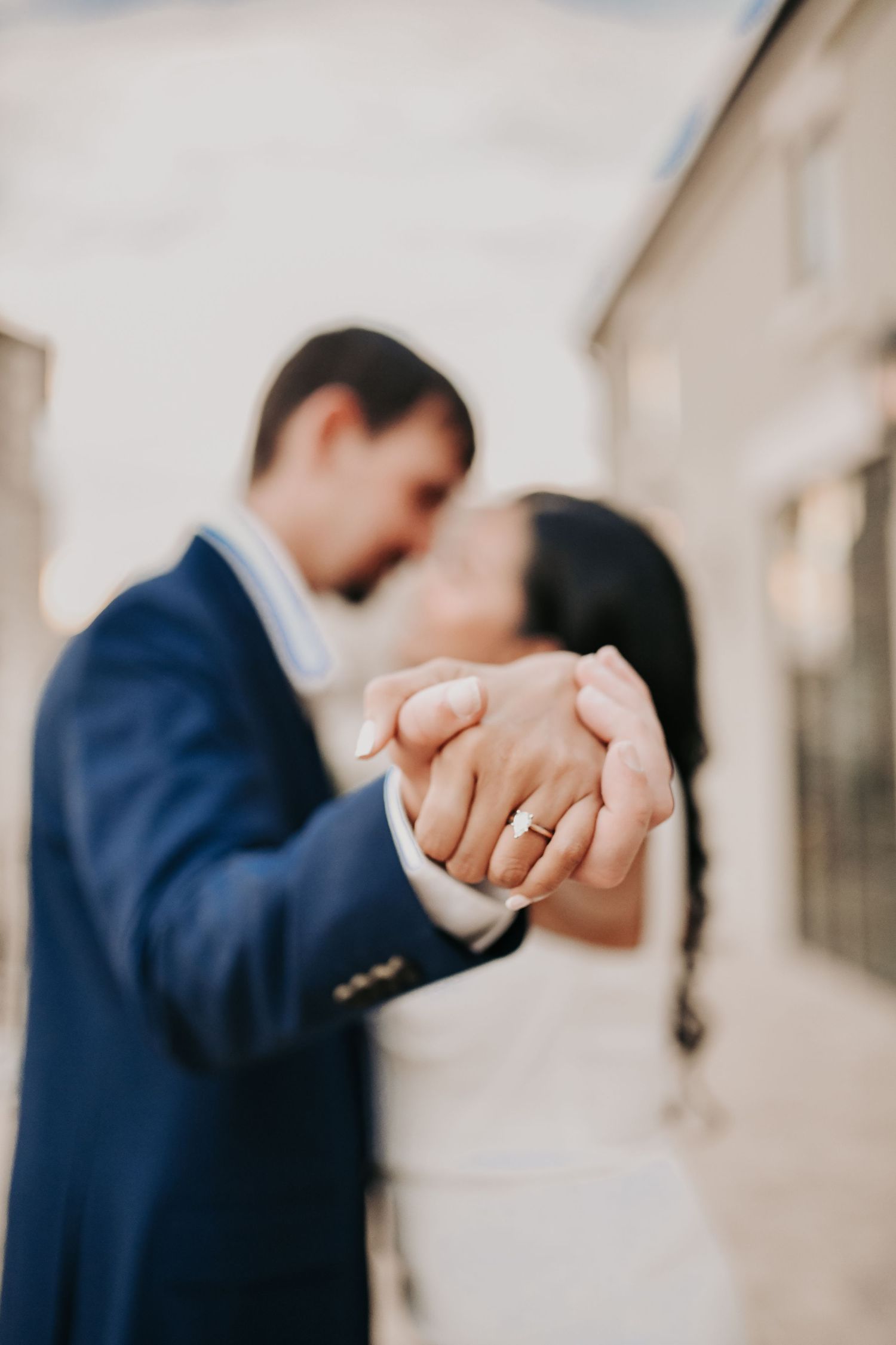 Romantic waterfront engagement photography featuring Chapel at Palacios in the background