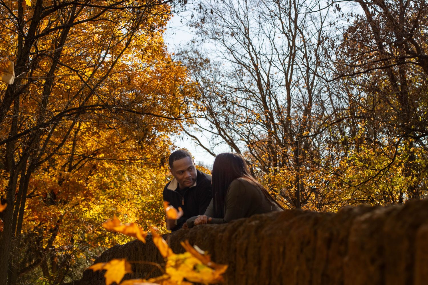 Couple posing during a Cincinnati mini fall session at Sharon Woods Park in Sharonville, Ohio, surrounded by beautiful autumn foliage.