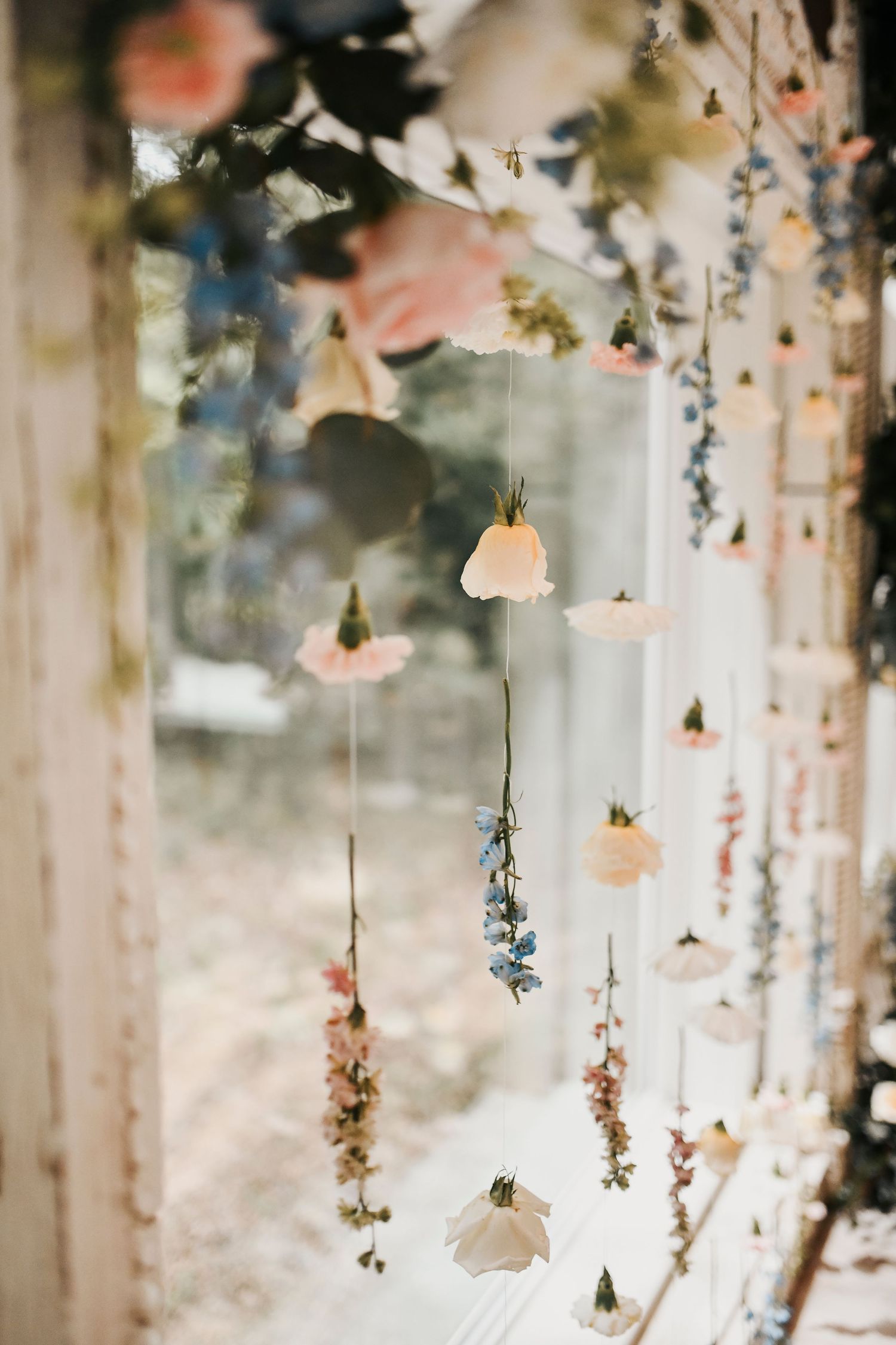 Pastel floral wedding ceremony aisle at The French Farmhouse in Collinsville Texas