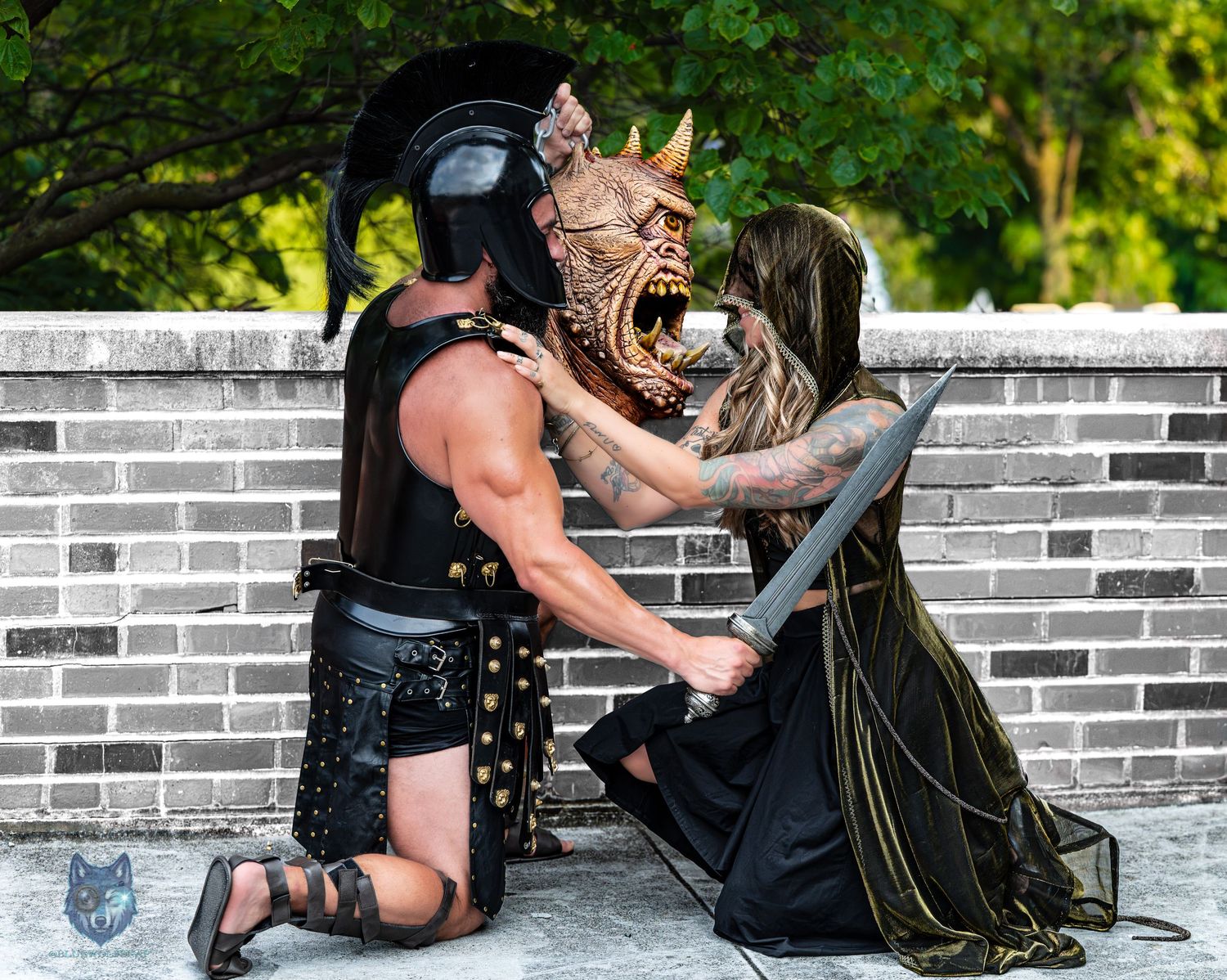 Fantasy cosplay photo of gladiator and hooded woman with monster mask outdoors. Chi.Shooters meet tonybrettman tattoo_jessie