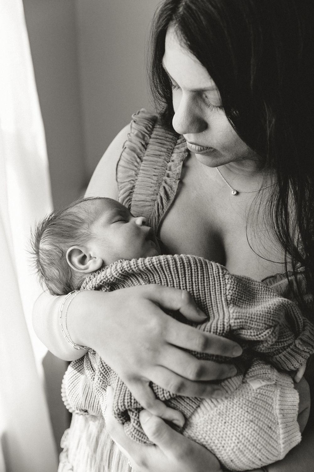 Sleepy baby with Mother during in-home newborn portrait session with Tyler Texas Newborn Photographer KP Portraits