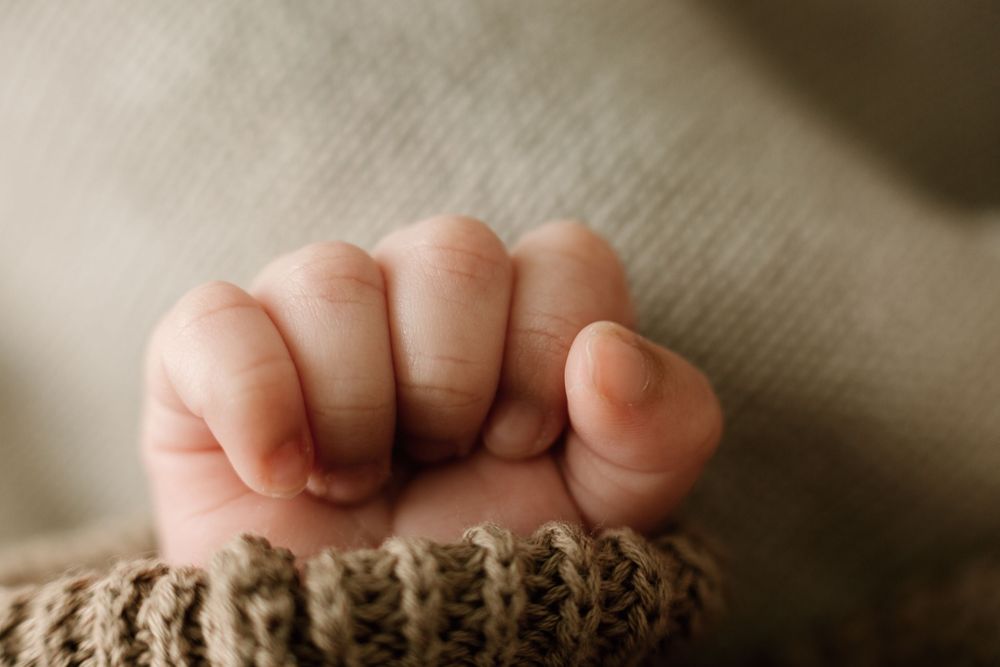 detail, up close hand shot during newborn portrait session East Texas