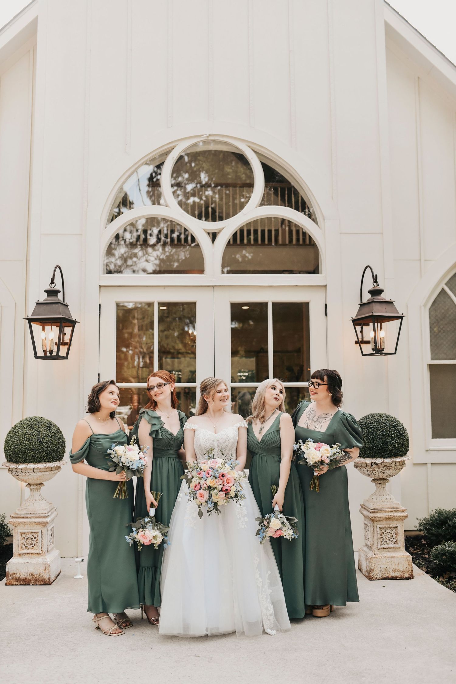 Kathryn with her bridesmaids in front of The French Farmhouse chapel