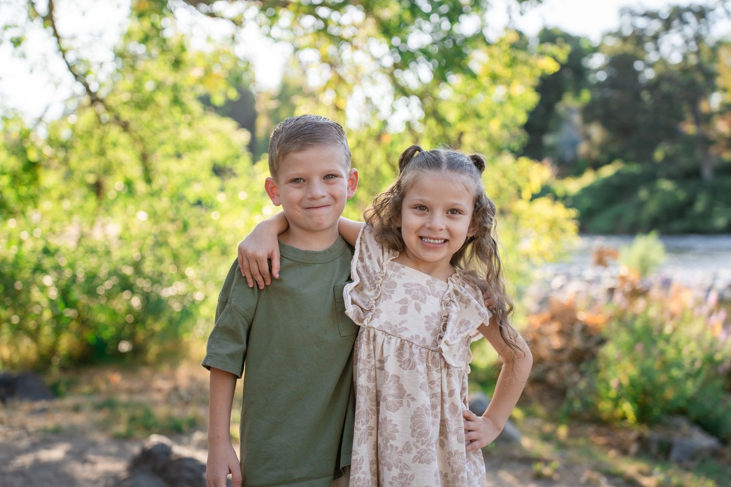 brother and sister sibling portrait by the river