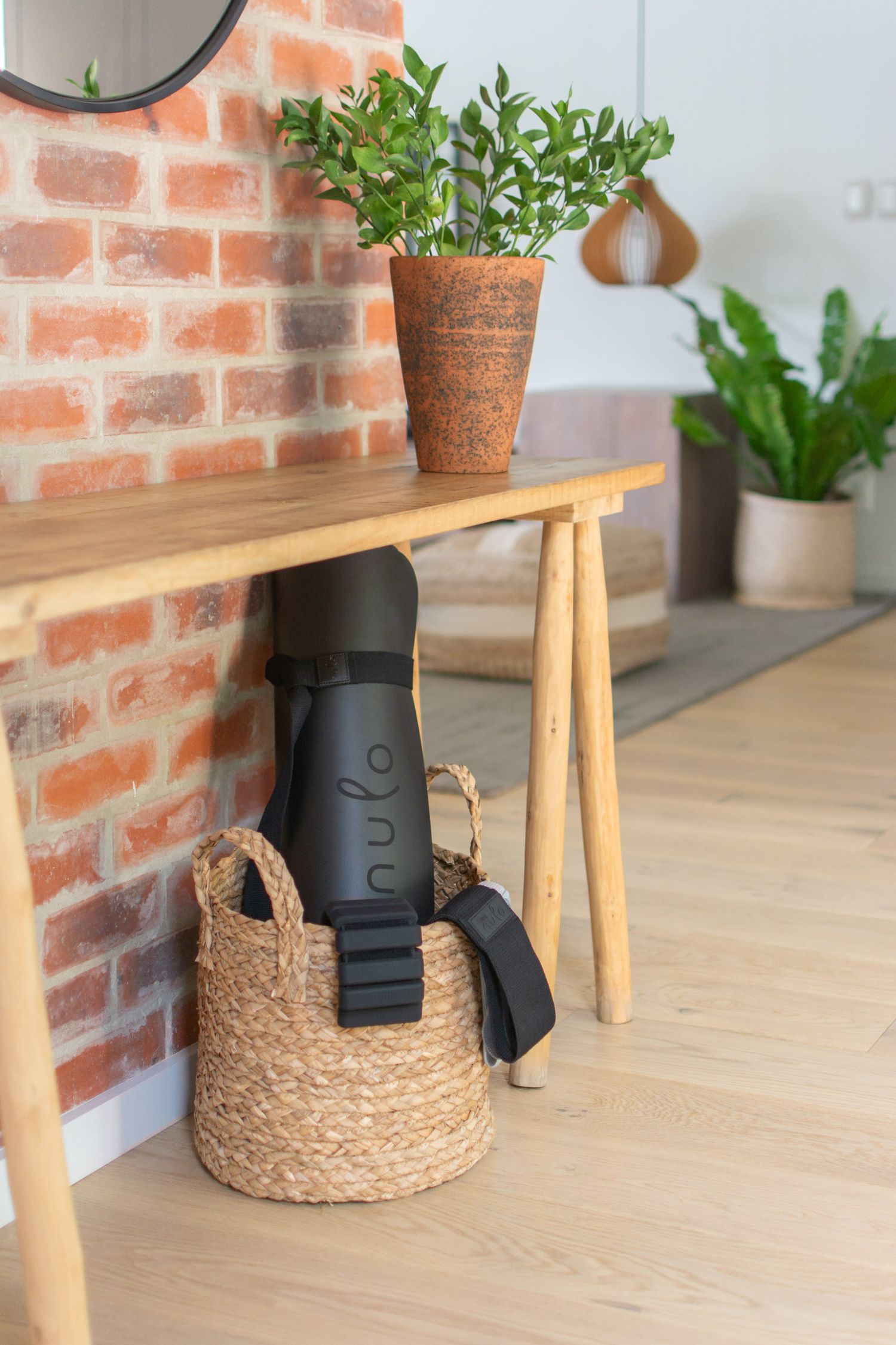 Lifestyle product photography of Nulo home workout equipment neatly packed in home setting.