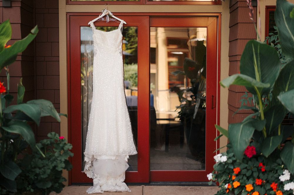 Bethany’s wedding dress hanging outside Willows Lodge before her Woodinville wedding.