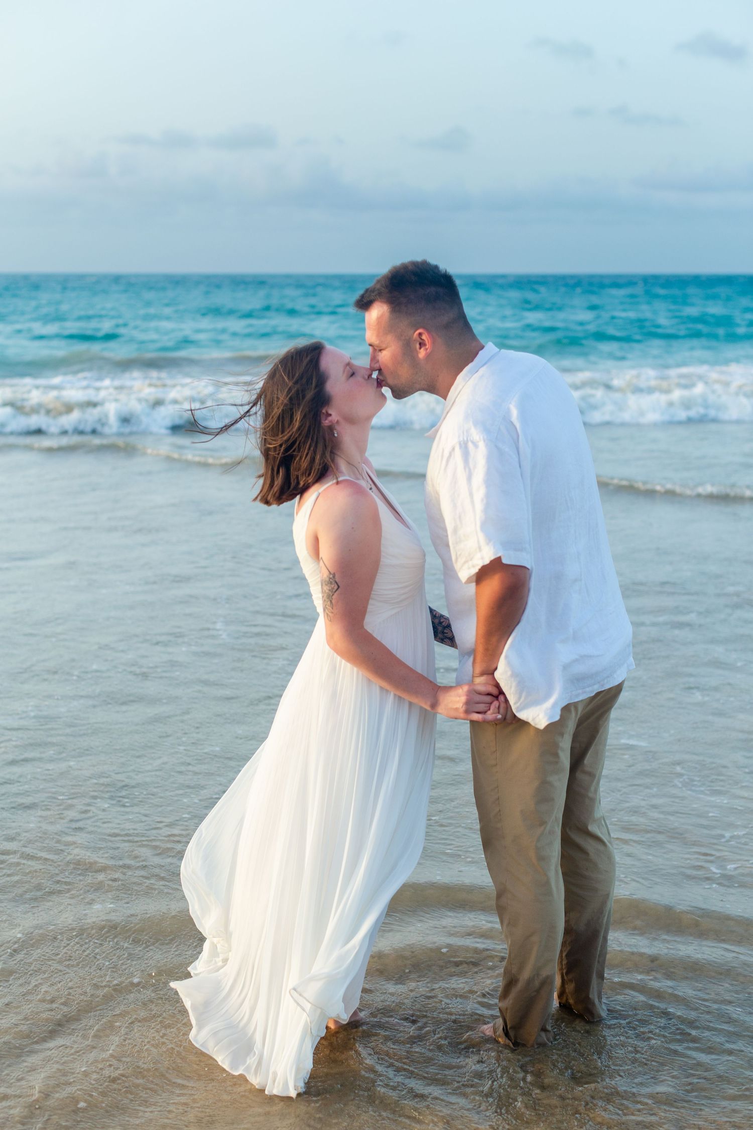 Couples portrait on the beach in Isla Verde, Carolina, Puerto Rico.