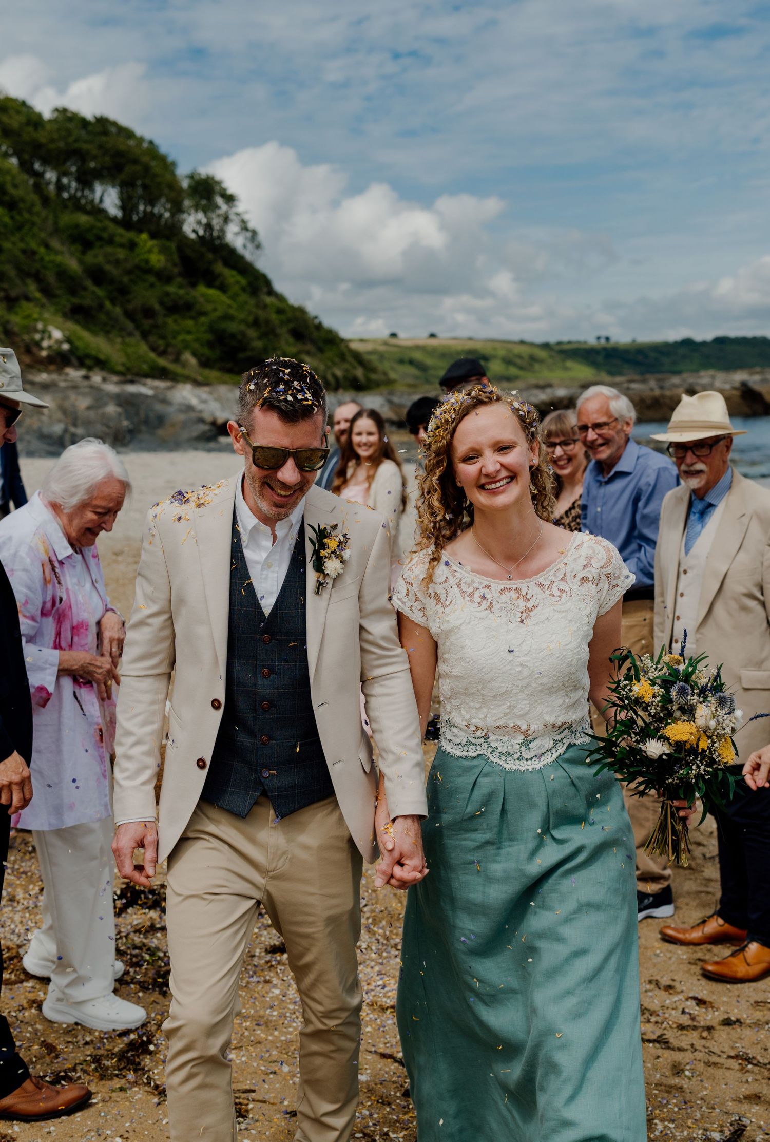 confetti tunnel on the beach after hotel meudon beach wedding ceremony
