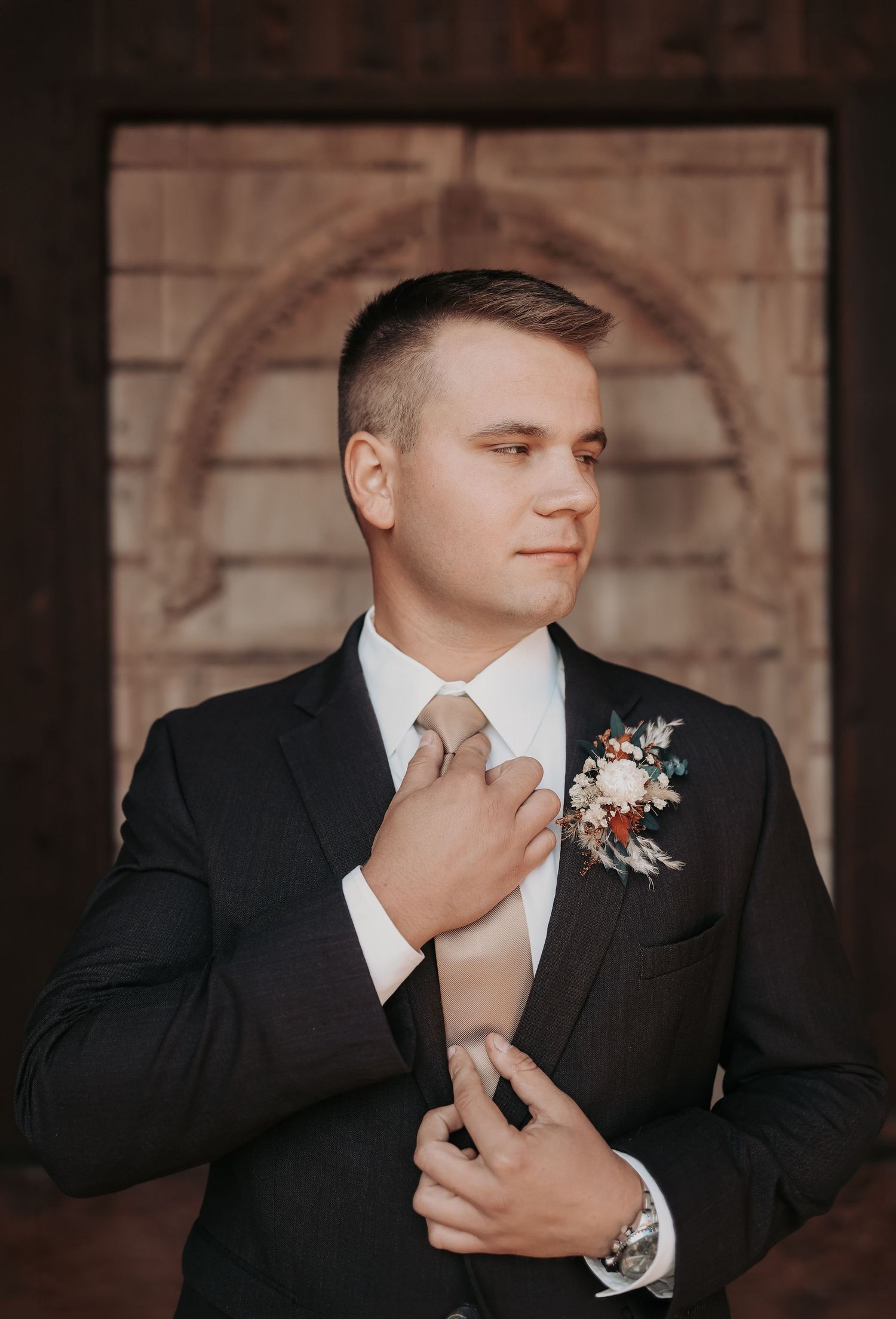 Groom getting ready for wedding at Lucky Spur Ranch in Justin Texas