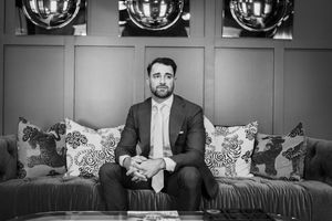 Black and white photo series showing a person sitting on a couch in various poses with dramatic lighting.