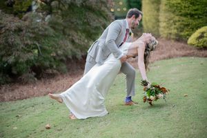 A collection of outdoor wedding photos showing a couple dancing and embracing on a grassy lawn.