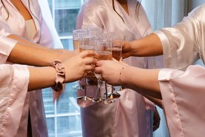 Close-up of hands joining together in a circle showing unity and teamwork concept.