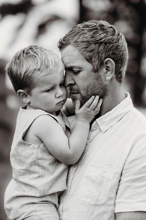 Tender black and white portrait showing affectionate moment.