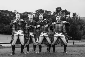 Black and White Image showing Scottish Gentlemen showing whats under their kilts at the Manor House Hotel in County Fermanagh