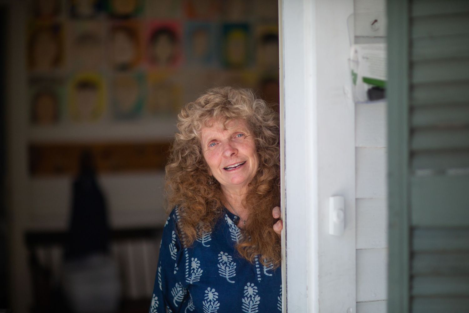 A sequence of shots showing someone with curly hair near a white doorframe.
