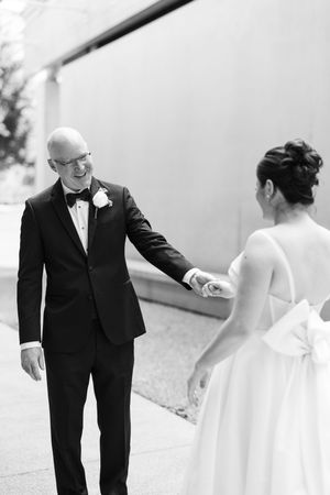 Black and white wedding photo sequence showing joyful first look reactions in an outdoor garden setting.