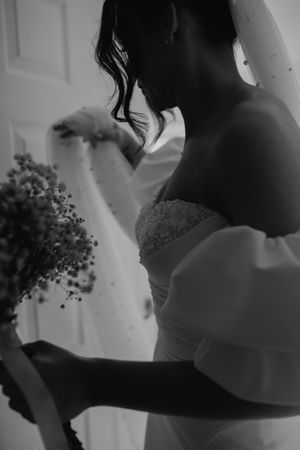 Intimate silhouette of a couple sharing a tender moment at their wedding celebration.