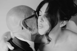 A black and white photo montage showing couples kissing passionately in intimate moments.