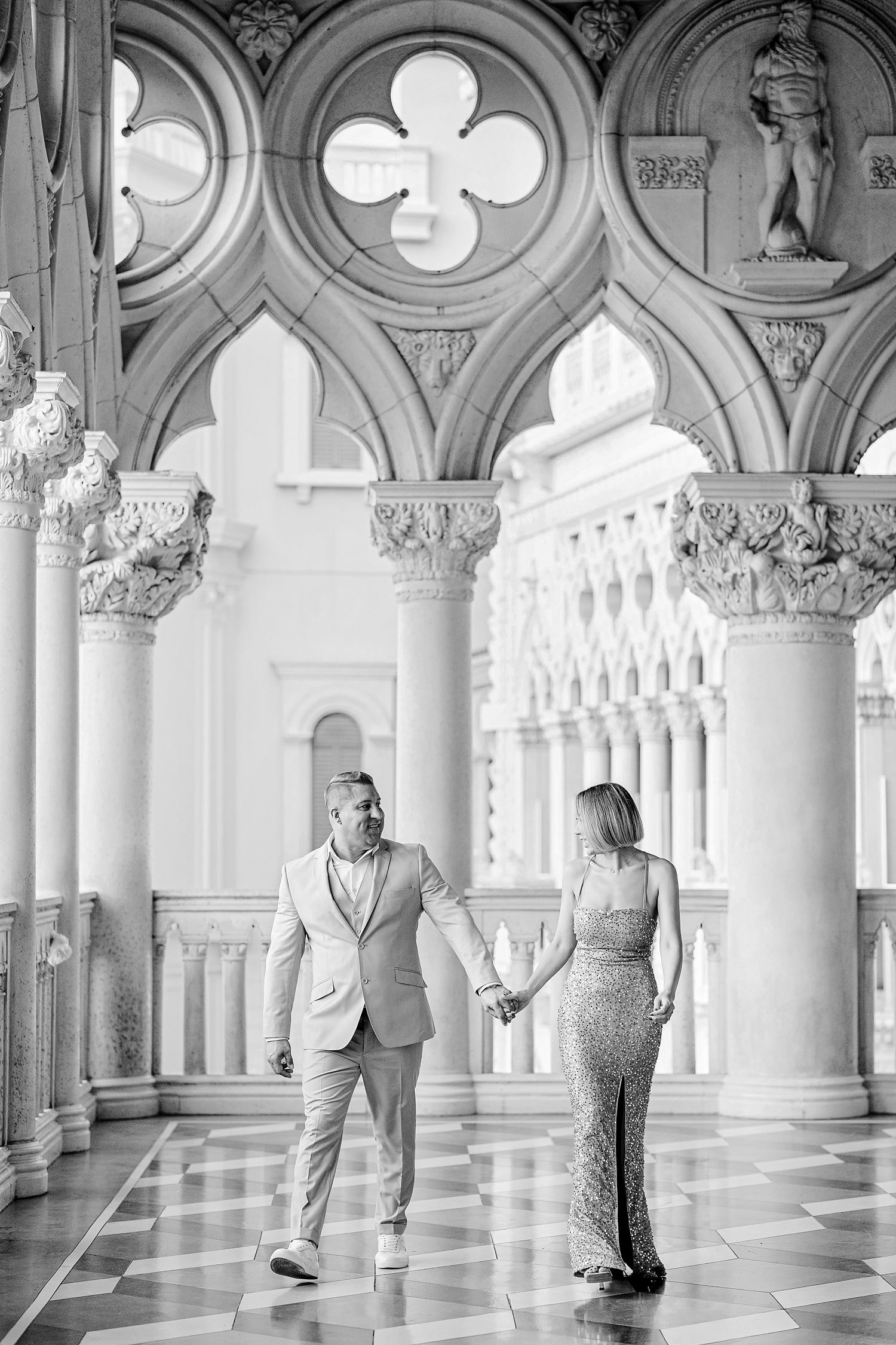 Knoxville wedding photographer capturing an elegant couple walking in luxury architecture