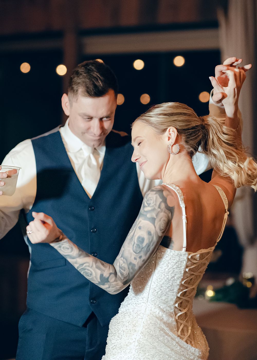 Bride and groom dancing together during their wedding reception at Lewallen Farms in Waleska Georgia.
