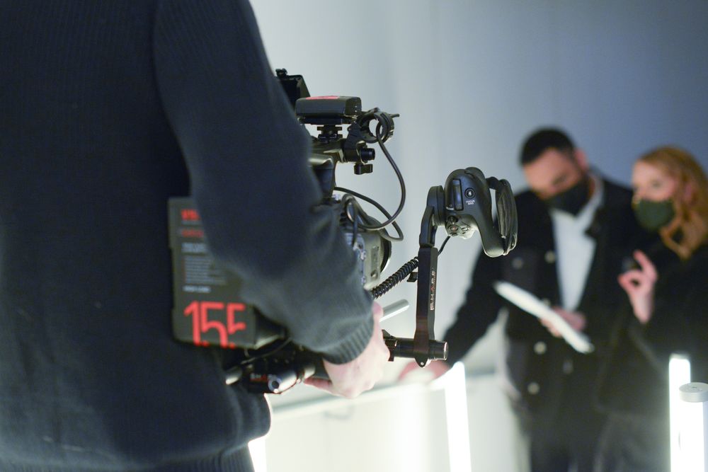 Behind the scenes footage of film crew with professional camera equipment.