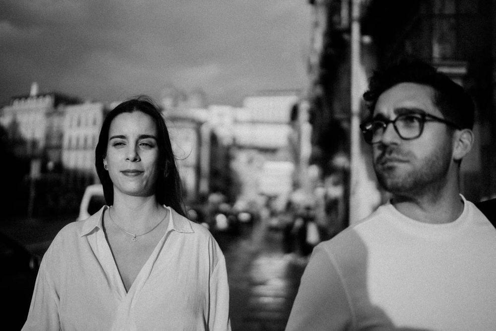 Natural light engagement portrait in Ribeira, shot in moody weather
