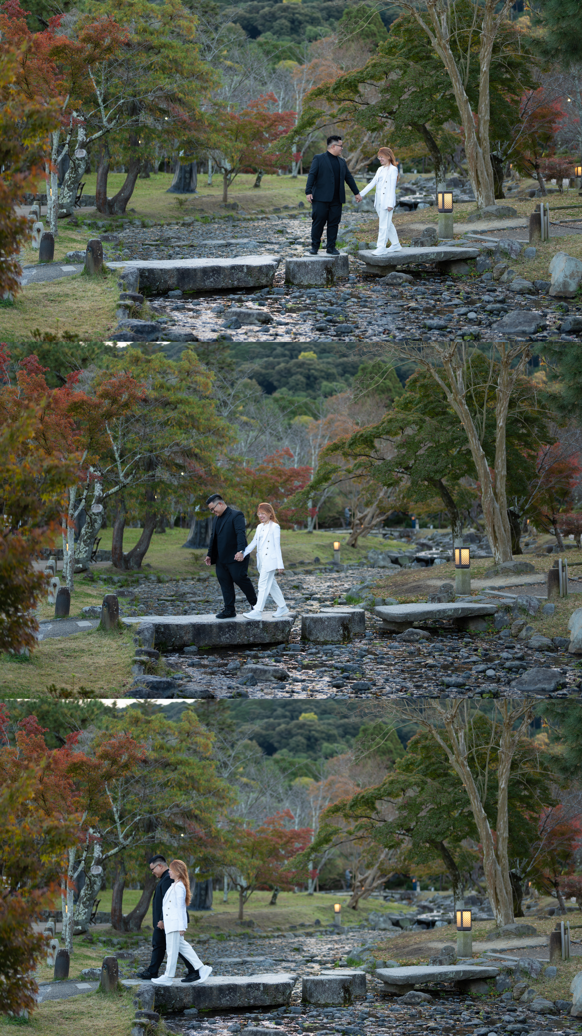 Couple walking hand-in-hand across stepping stones in a Japanese autumn garden.