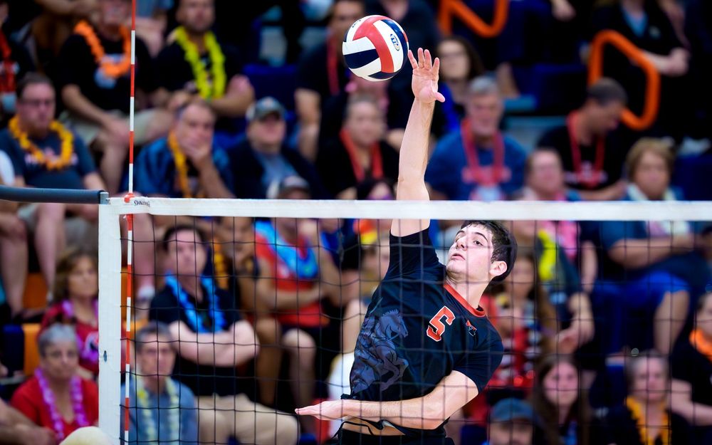 Hempfield hitter swings vs Cumberland Valley, PIAA boys volleyball semifinals by Deanna Fox, SportsFox Photography based in Hershey PA.