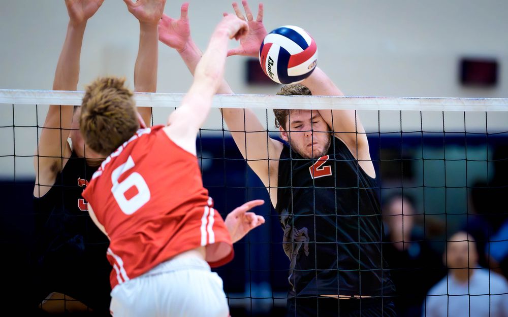 Hempfield block meets a Cumberland Valley spike, PIAA boys volleyball semifinals by Deanna Fox, SportsFox Photography based in Hershey PA.
