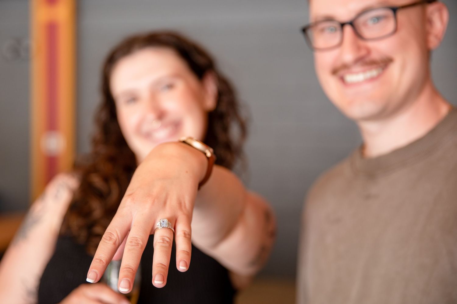 Chad places the engagement ring on Teresa's finger while Julep the penguin joins the celebration.