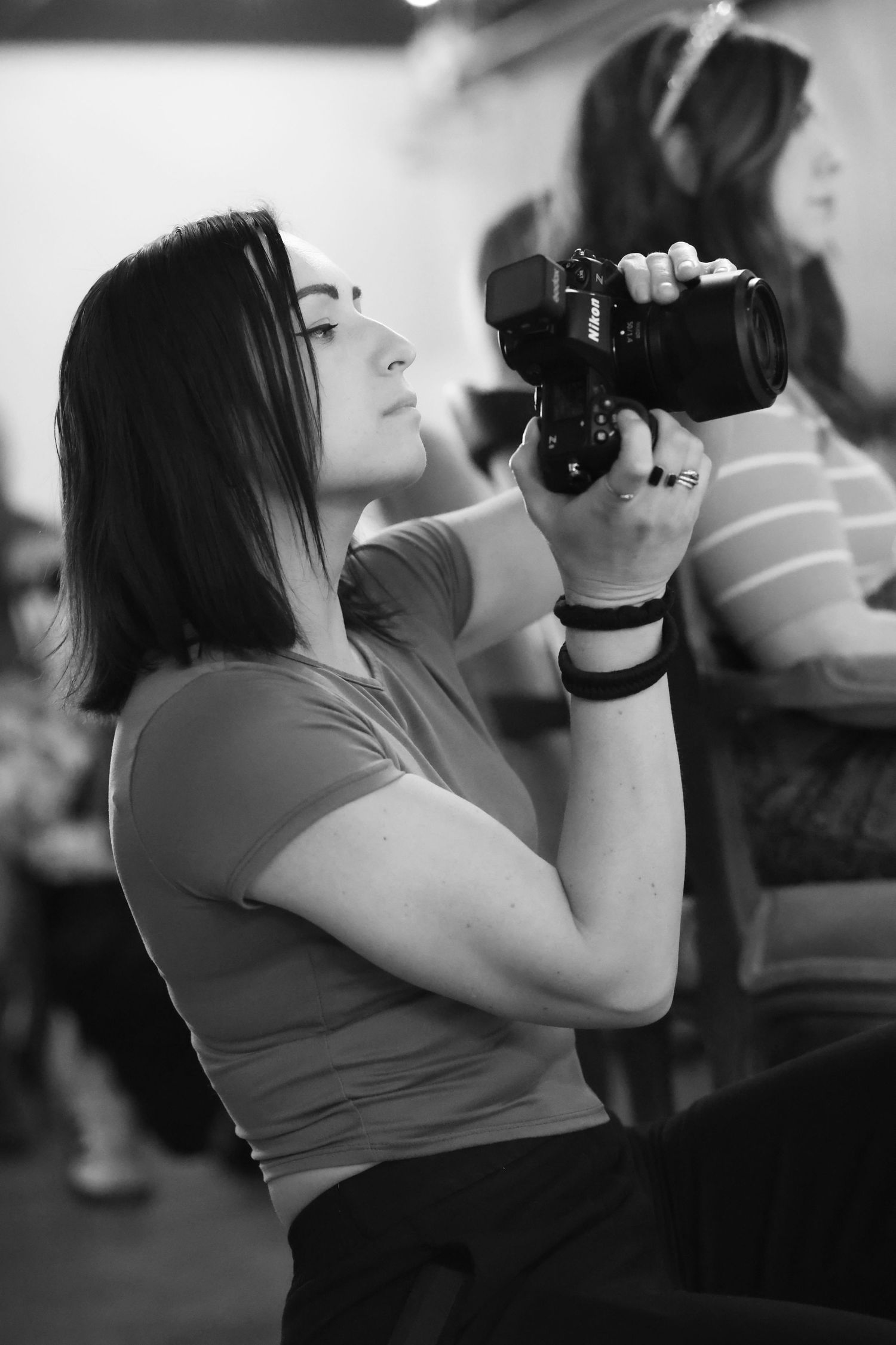 photographer Maria Tsev capturing people at corporate event