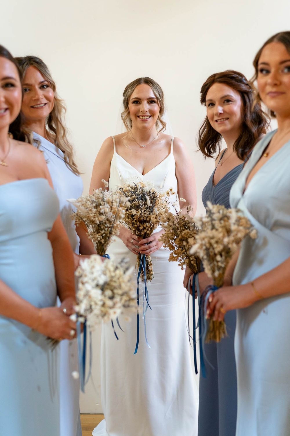 Bride with bridesmaids at the Corn Barn in Cullompton