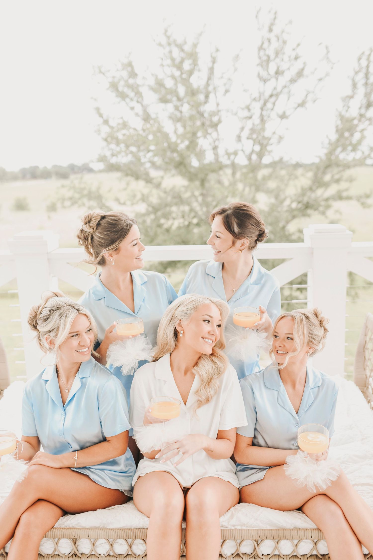 Bridal party celebrating with champagne before ceremony