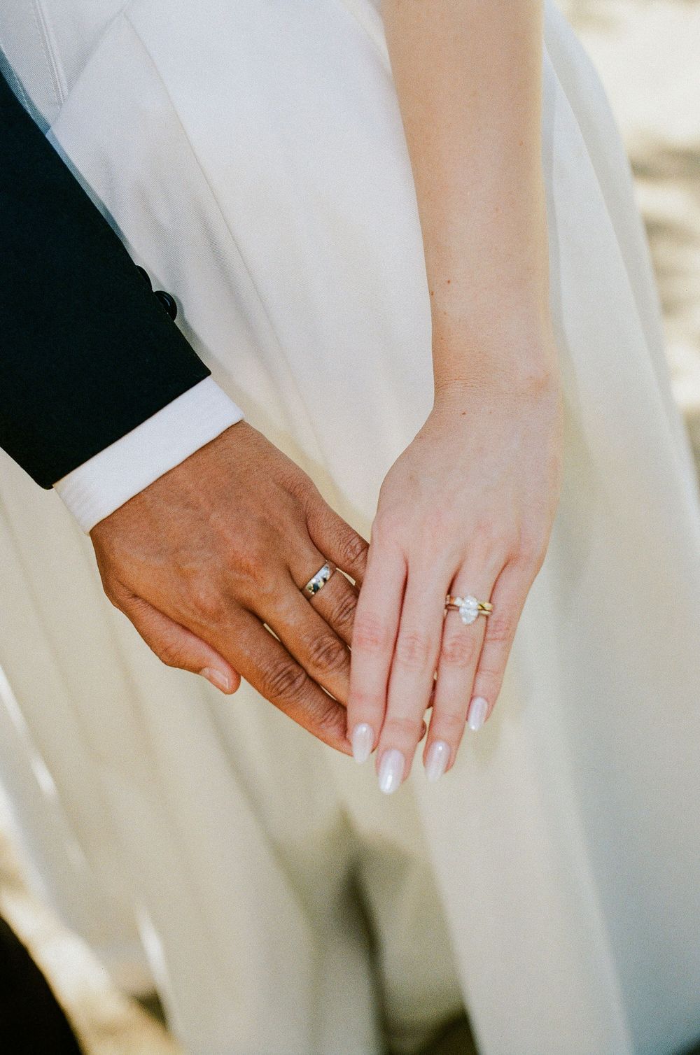 A close-up, editorial 35mm film photograph of modern, curated wedding details at a luxury event venue servicing NC.
