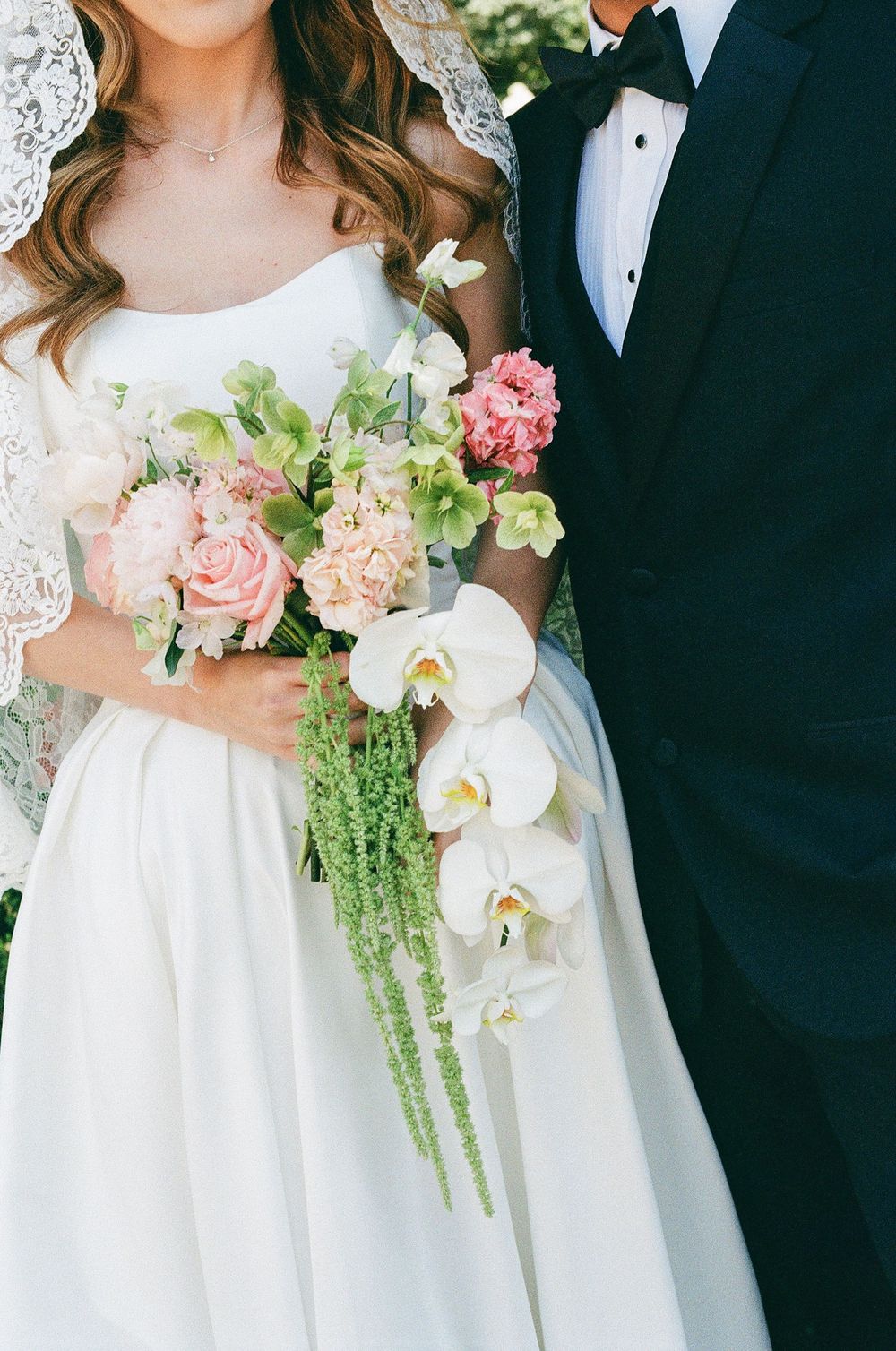 A grainy film photo of a bride's bouquet photographed by an NC Charlotte and Asheville wedding photographer.