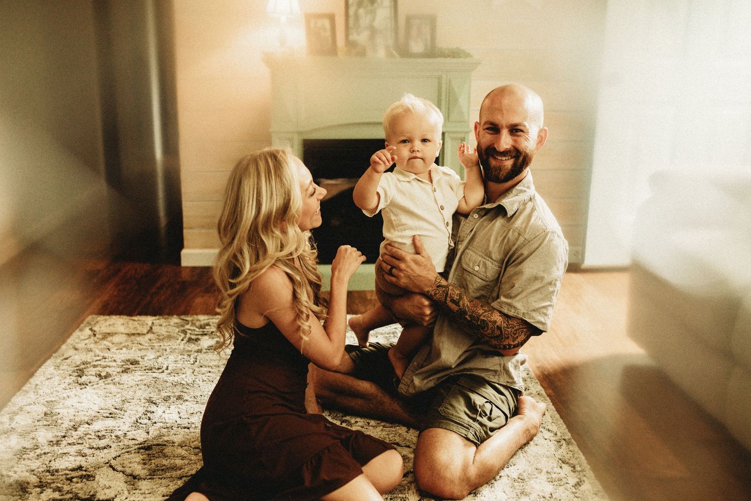 Family sitting in their floor while smiling