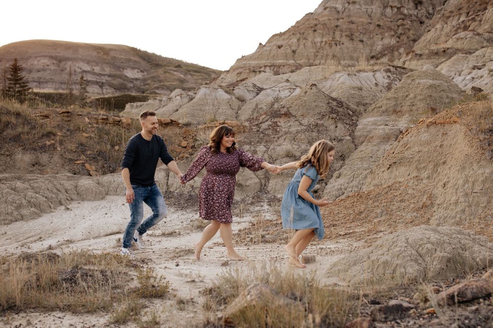 Family enjoying outdoor adventure on rugged desert terrain.