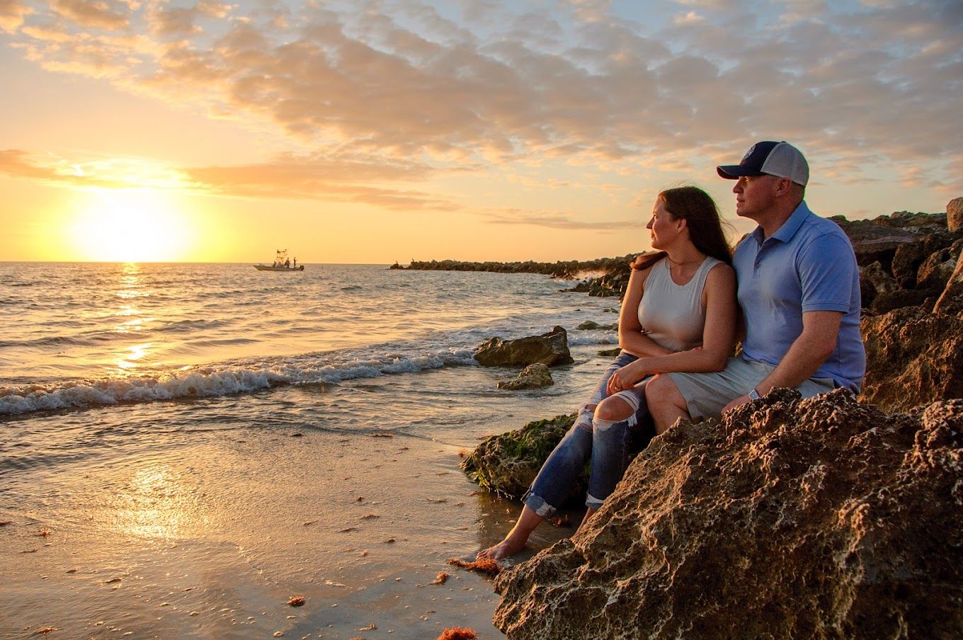 photo of couple on rocks watching sunset in New Port Richey