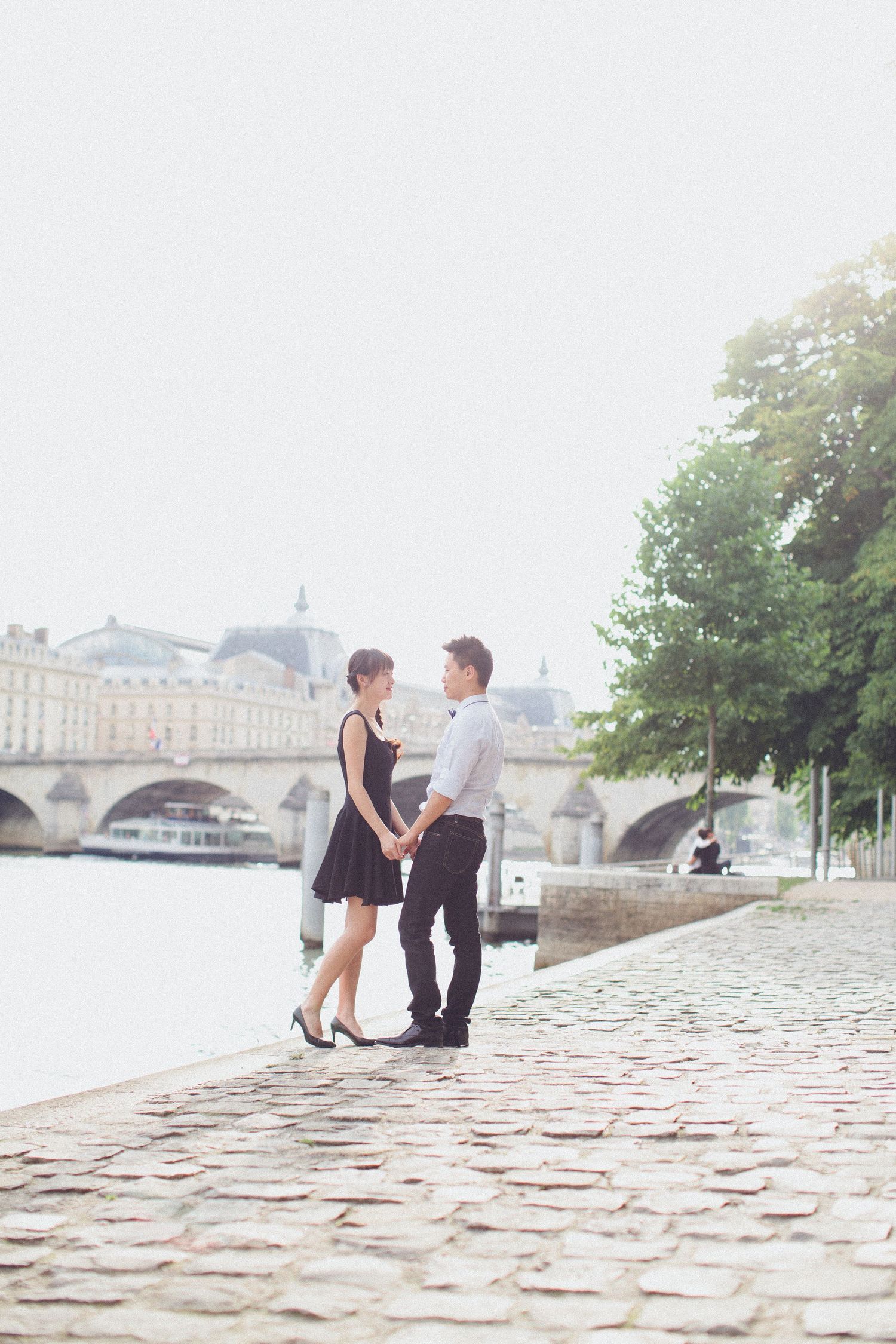 Bride and groom portrait during a romantic along  the Seine in Paris