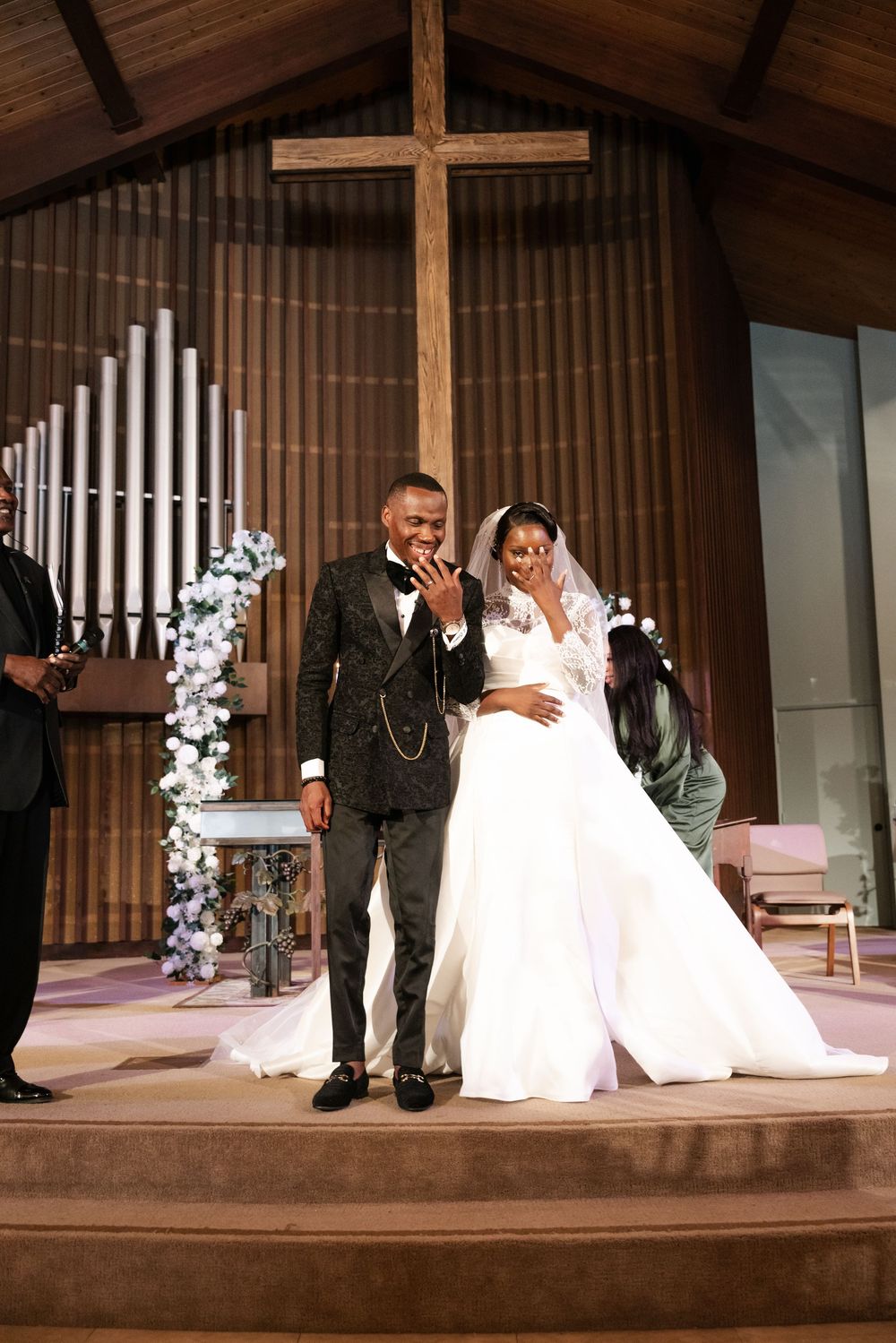 Wedding ceremony sequence showing couple sitting and standing on wooden stage with floral decorations.