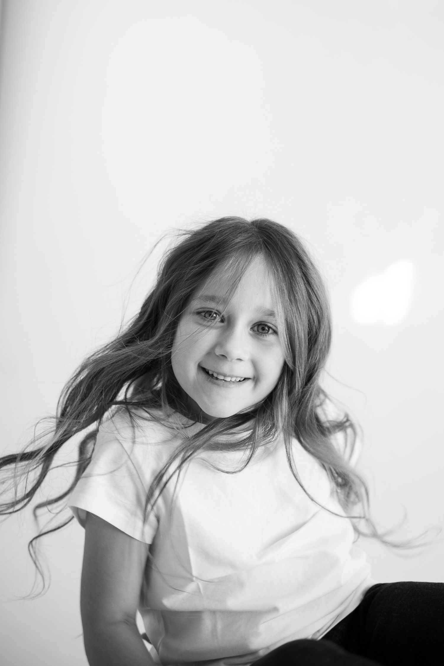 A series of close-up portraits showing different expressions in black and white against a white background.