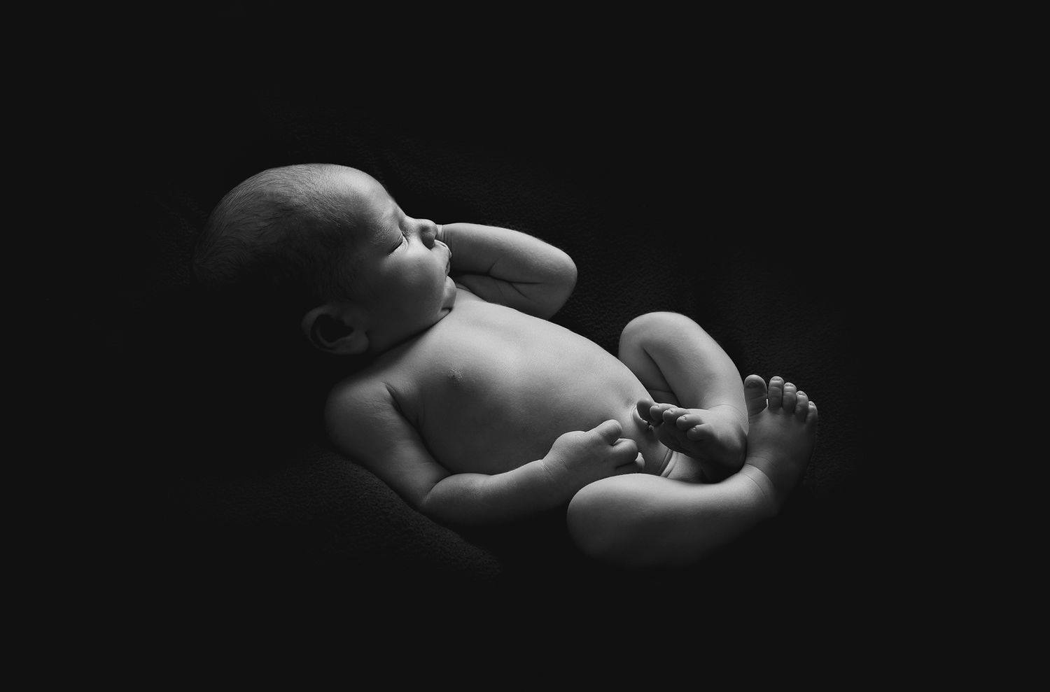 Award winning newborn photography Gold Coast featuring sleeping baby in a pose.