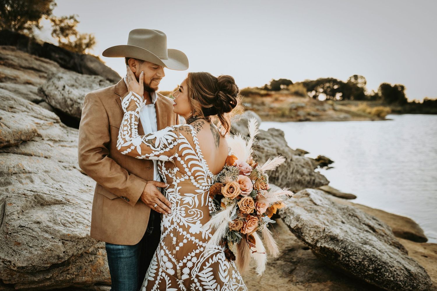 Romantic rustic wedding photo of a newly married couple gazing at each other