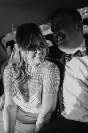 Black and white photo sequence showing a couple in a car sharing intimate moments, with one wearing white clothing.