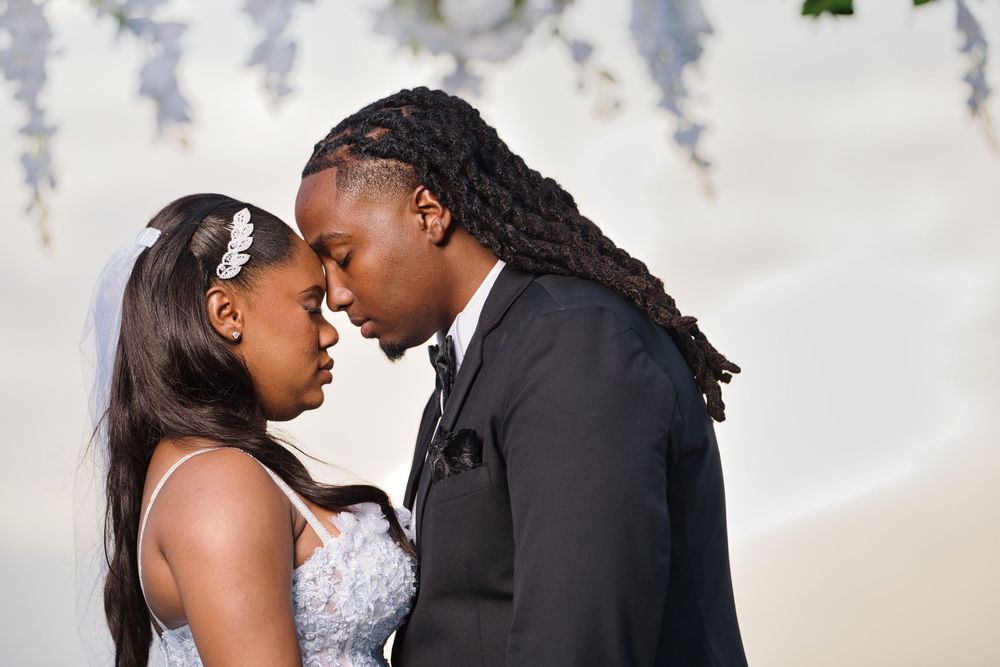 Close-up black and white wedding photos capturing intimate moments between newlyweds against a light background.