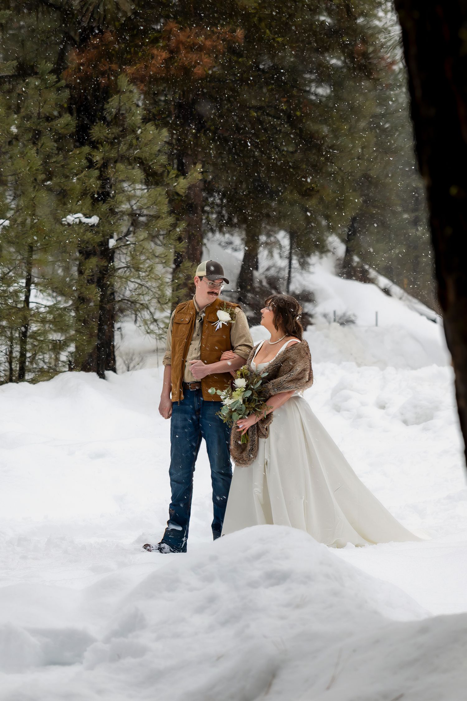 Bride and groom walking down the aisle. Idaho snowy mountain elopement. Milestones Studios LLC elopement