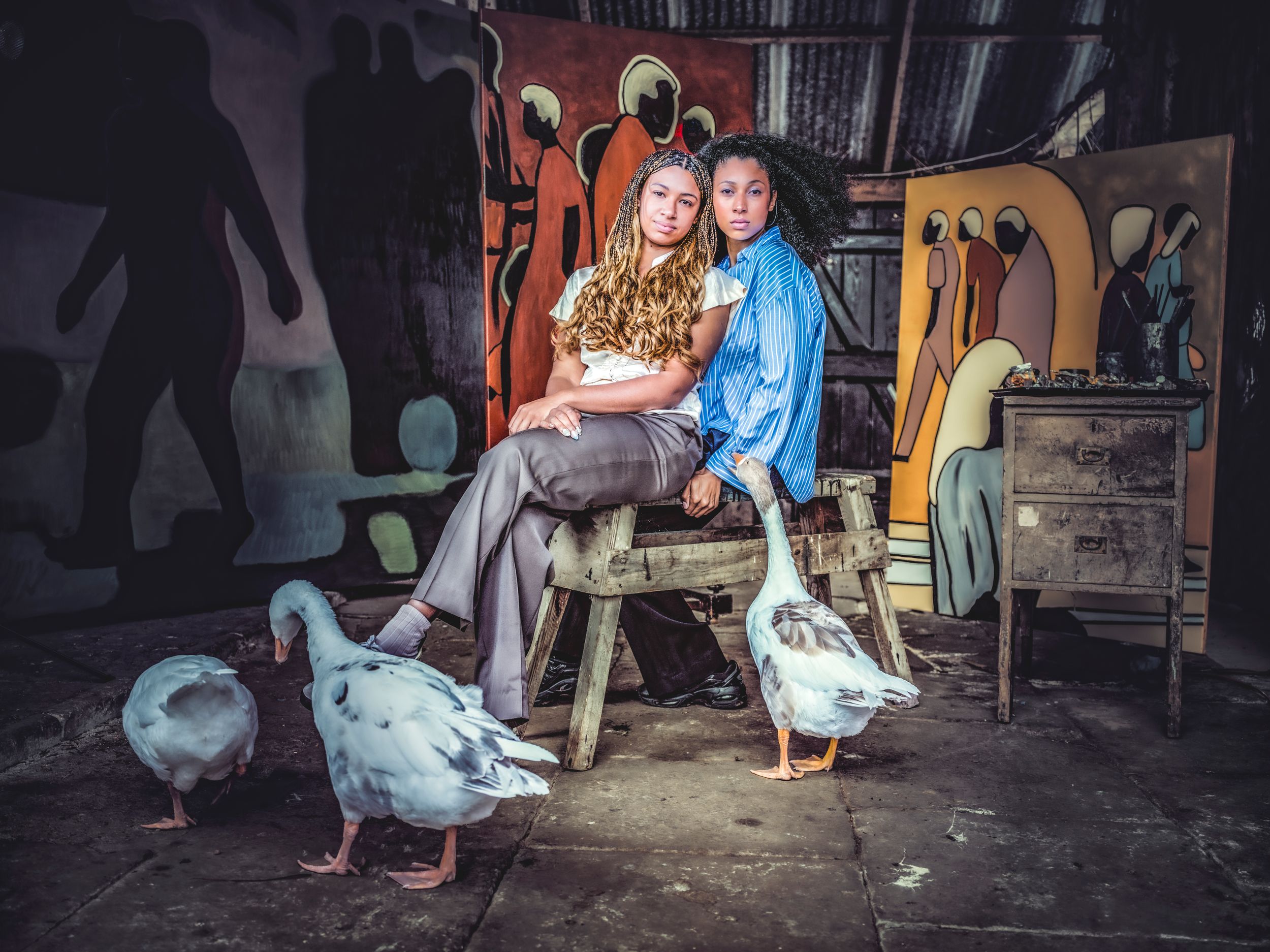 Editorial portrait of artists Edwina and Sahara Longe in their barn studio, Suffolk