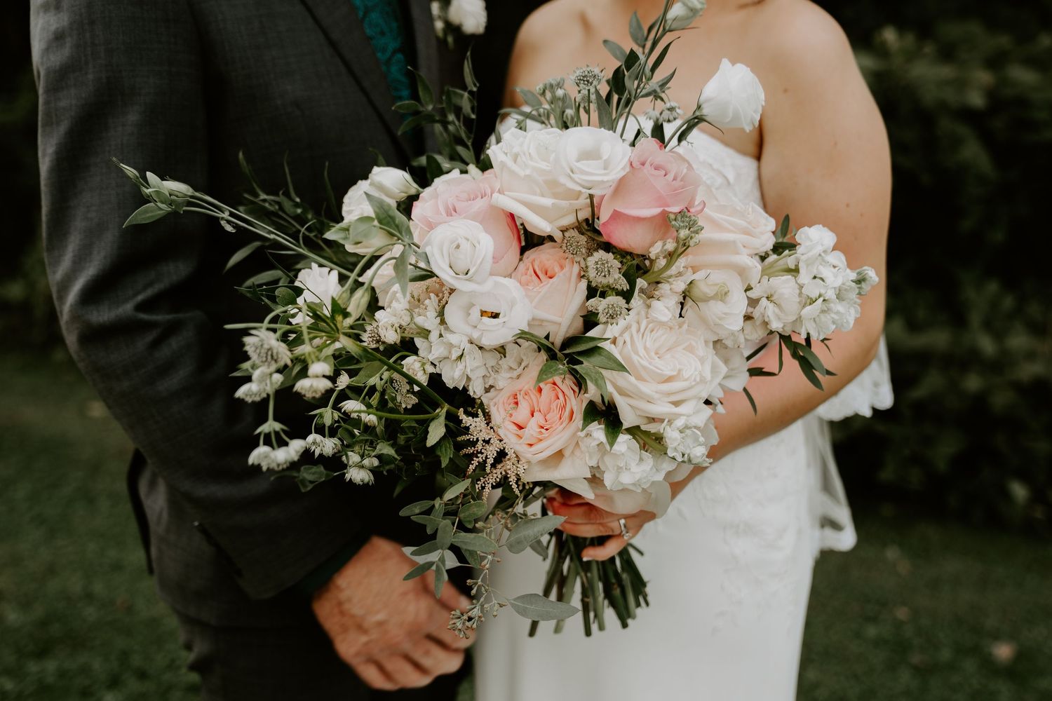 close up of brides beautiful pink hued bouquet of flowers