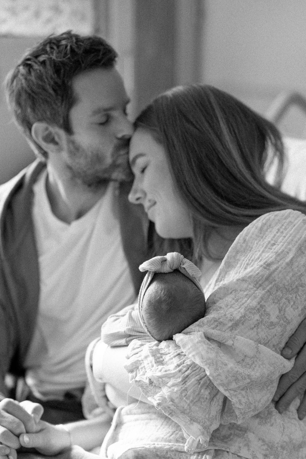 A romantic black and white photo sequence showing a couple sharing intimate kisses and tender moments together.