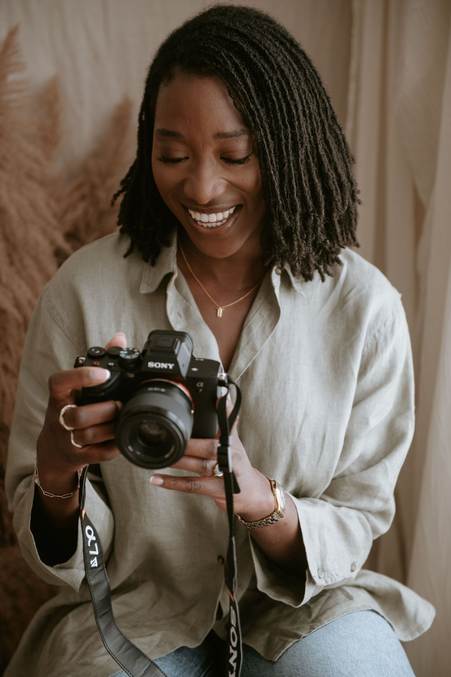 Black female photographer specialising in maternity, newborn and family photography